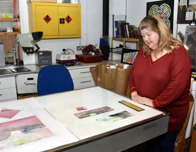 Jo sees Olivia's window design in progress